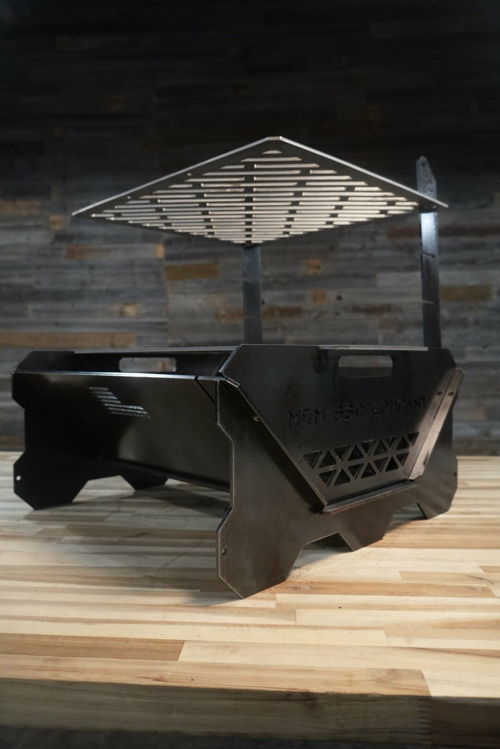 FireFly collapsible grill with the upper grate raised