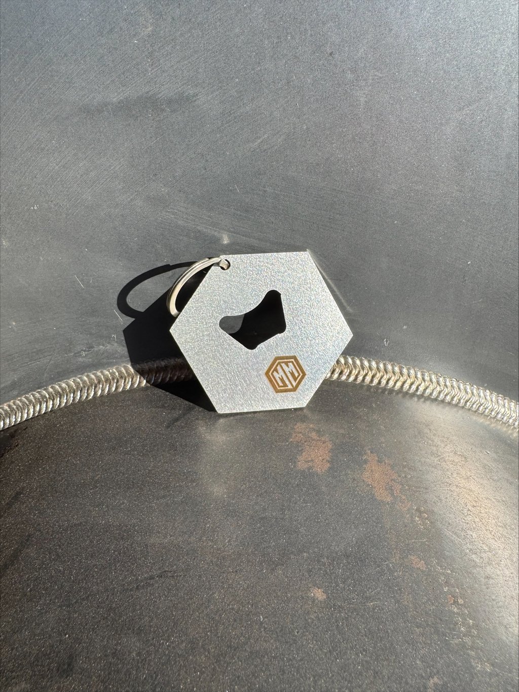 Hexagon M&M bottle opener on a keychain