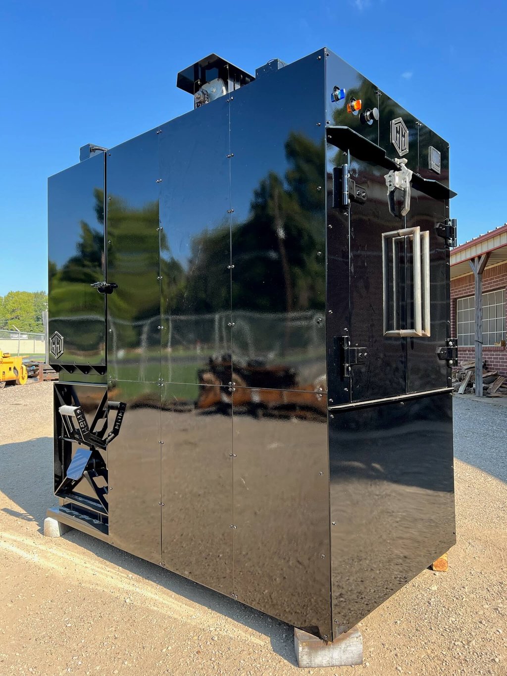 Glossy black MM240 rotisserie smoker, side view