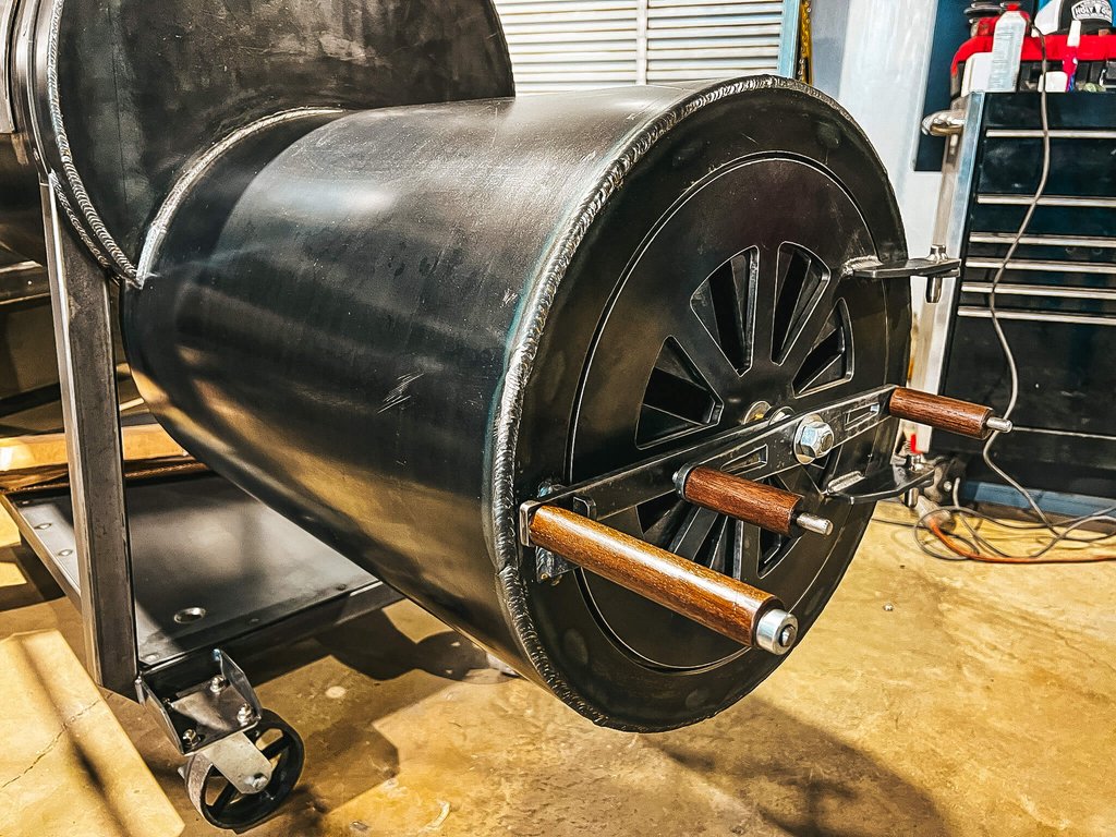 Texas Smoke King firebox door with a spoked air damper and wood handles